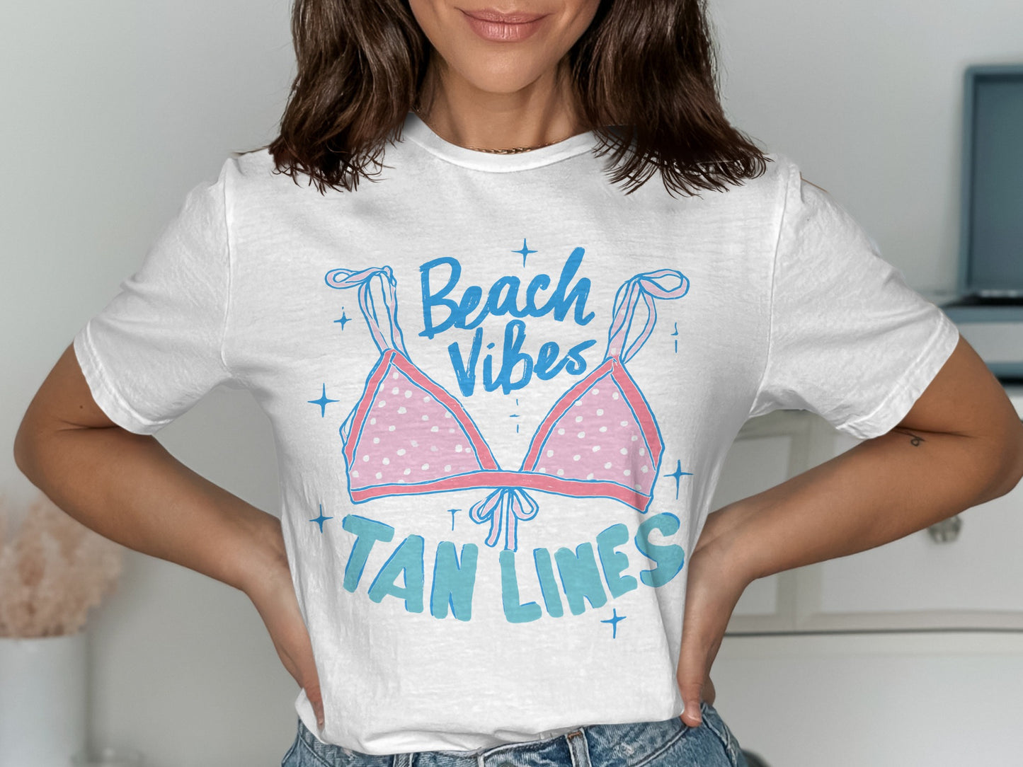 White t-shirt with pink polka dot bikini and "Beach Vibes Tan Lines" text.