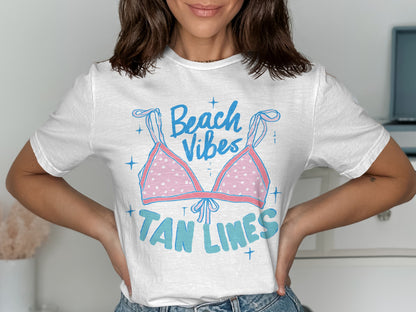 White t-shirt with pink polka dot bikini and "Beach Vibes Tan Lines" text.