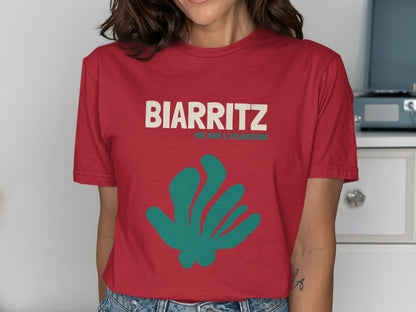 Red t-shirt with teal abstract shape and "BIARRITZ" text.
