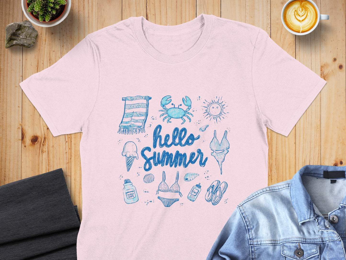Pink t-shirt with "Hello Summer" graphic featuring beach items.
