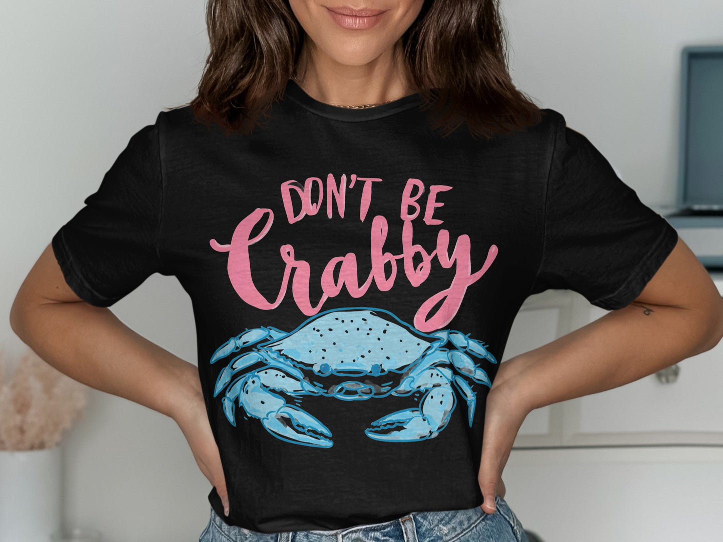 Black t-shirt with "Don't Be Crabby" and a blue crab graphic.