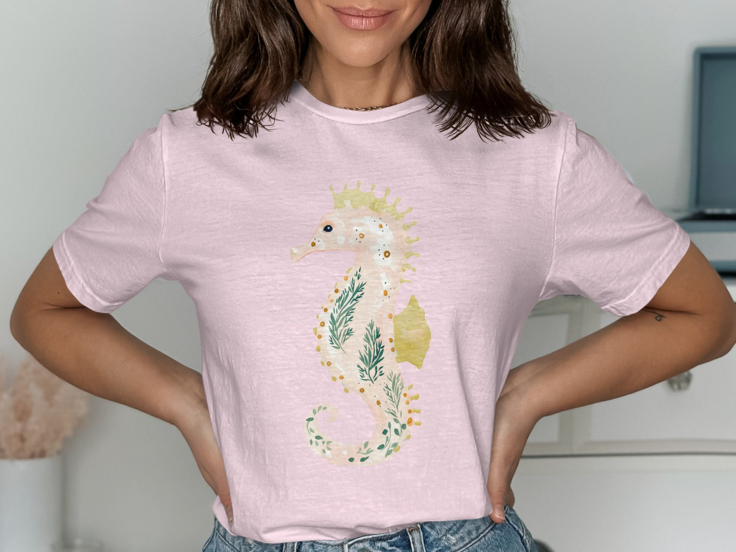 Light pink t-shirt with a whimsical seahorse and floral design.