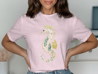 Light pink t-shirt with a whimsical seahorse and floral design.