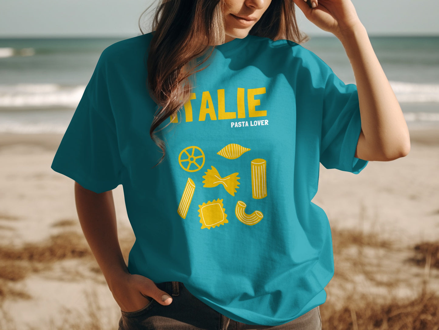 Teal t-shirt with yellow pasta illustrations and "ITALIE PASTA LOVER" text.