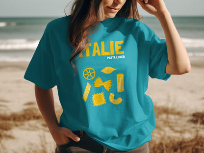 Teal t-shirt with yellow pasta illustrations and "ITALIE PASTA LOVER" text.