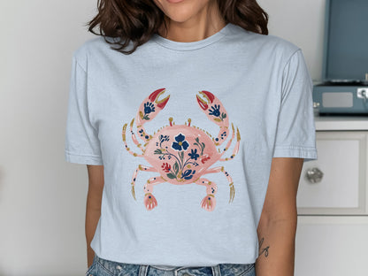 Light blue t-shirt with a floral crab graphic.