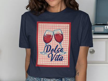 Two wine glasses clinking with "Dolce Vita" text on a gingham background.