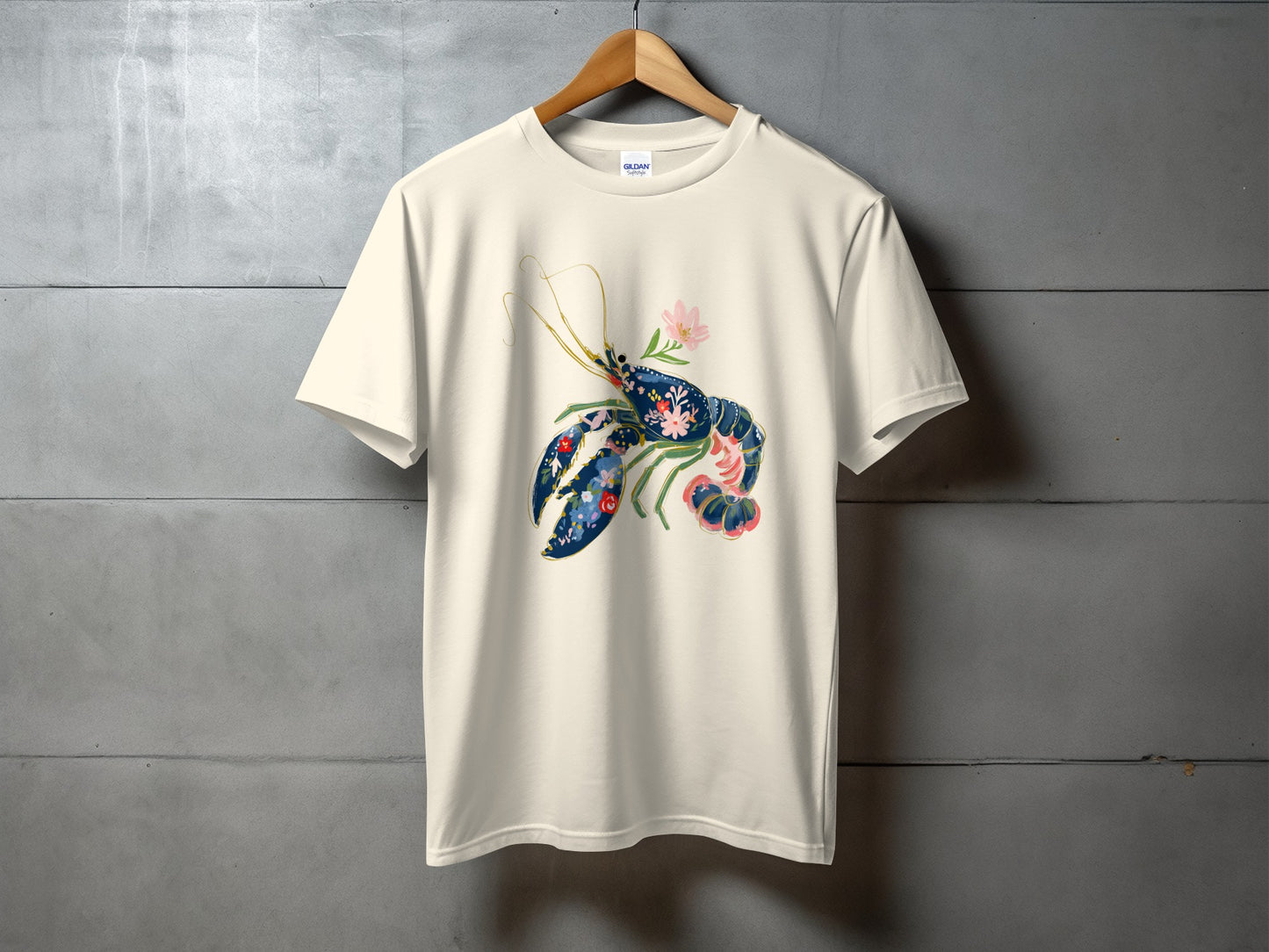 Cream t-shirt with a stylized blue and pink lobster graphic.