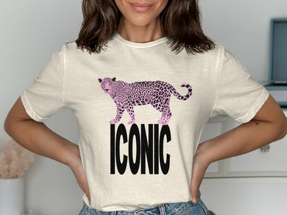 Cream t-shirt with black "ICONIC" text and a pink spotted leopard graphic.