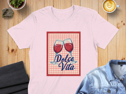 Two wine glasses toast within a checkered frame, text reads "Dolce Vita."