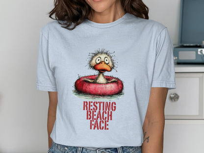 Cartoon duck with "RESTING BEACH FACE" text on light blue t-shirt.
