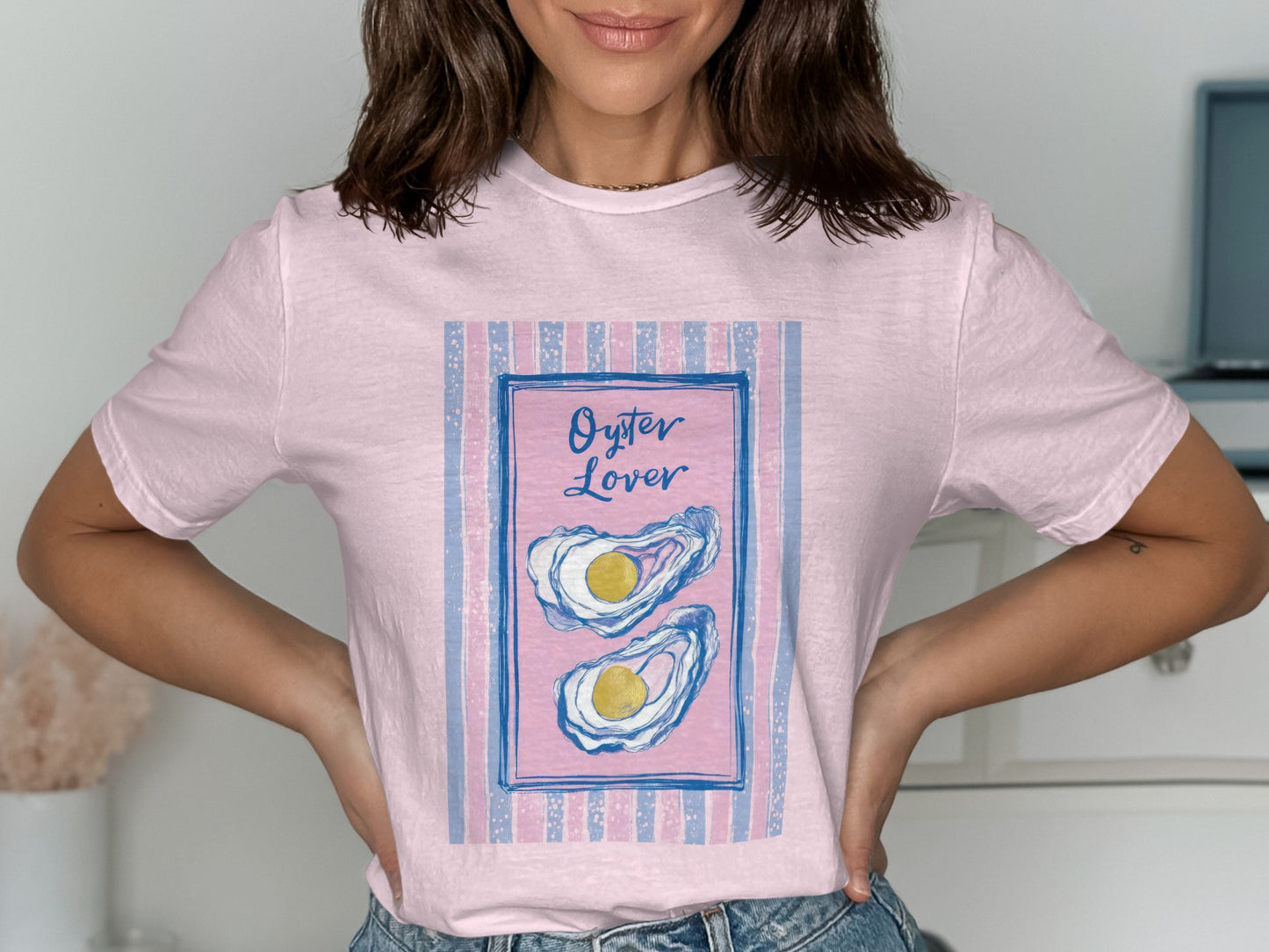 Pink t-shirt with a framed illustration of two oysters and "Oyster Lover" text.