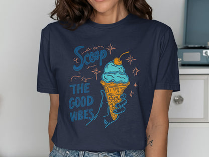 Navy t-shirt with ice cream cone and "Scoop the good vibes" text.