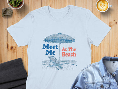 Light blue t-shirt with "Meet Me At The Beach" text and beach umbrella graphic.