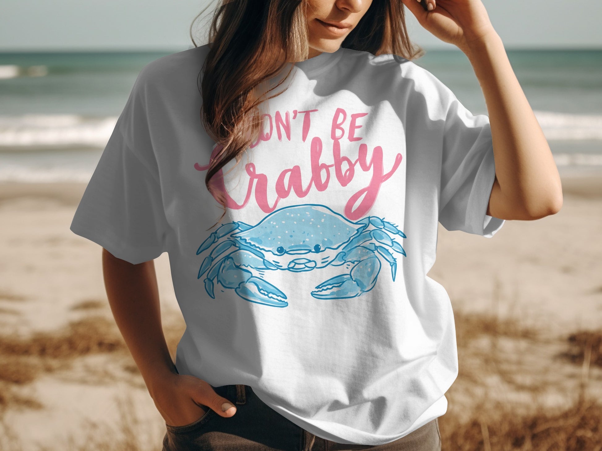 White t-shirt with blue crab graphic and "Don't Be Crabby" text.