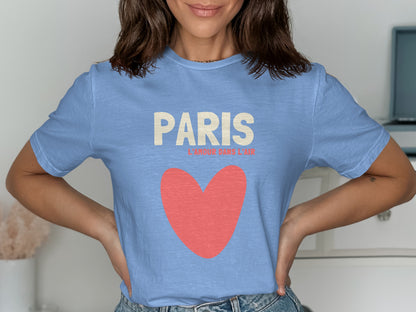 Light blue t-shirt with "PARIS L'AMOUR DANS L'AIR" and red heart.