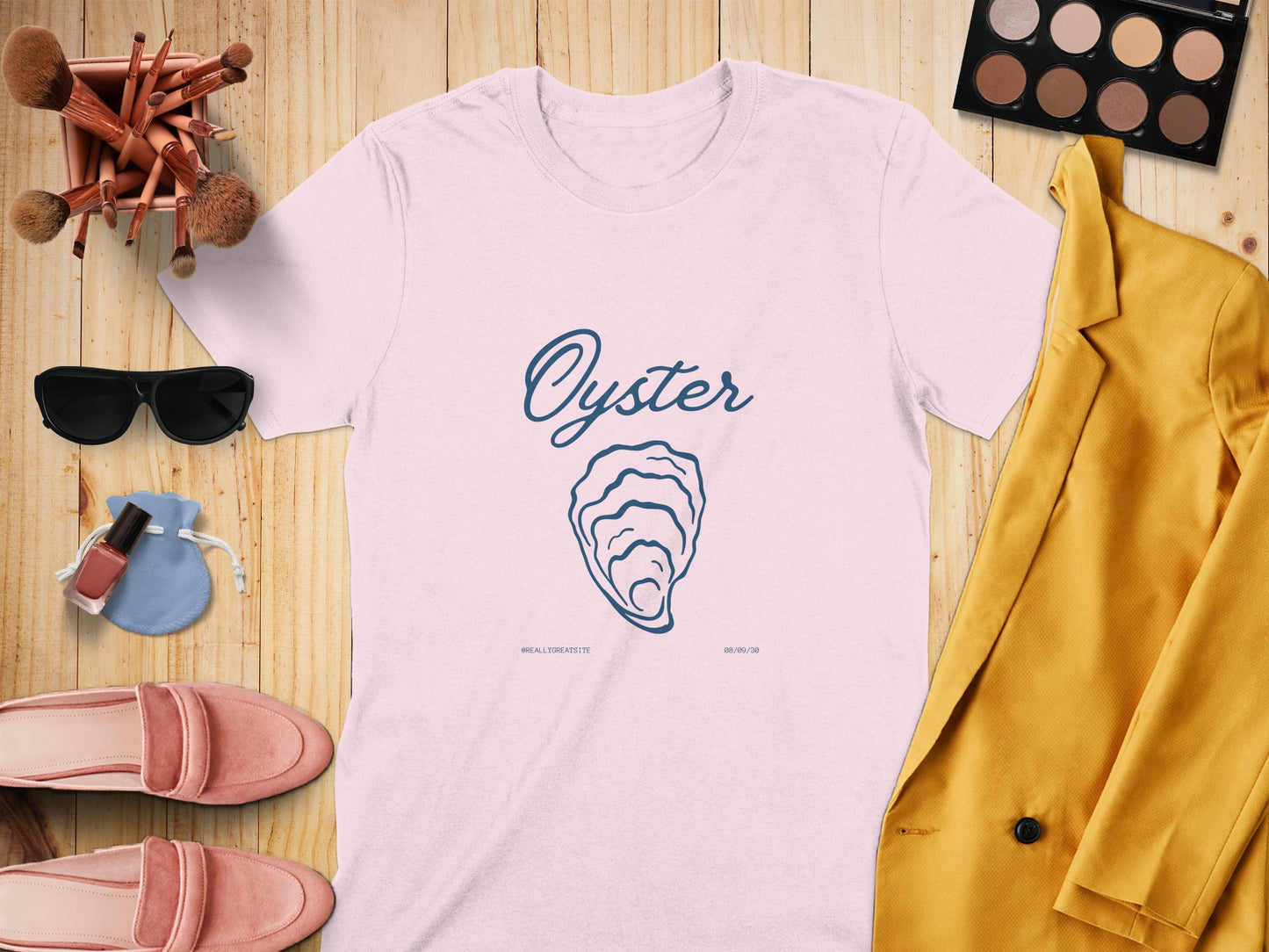 White t-shirt with blue oyster graphic and text "ALL THE SEASIDE".