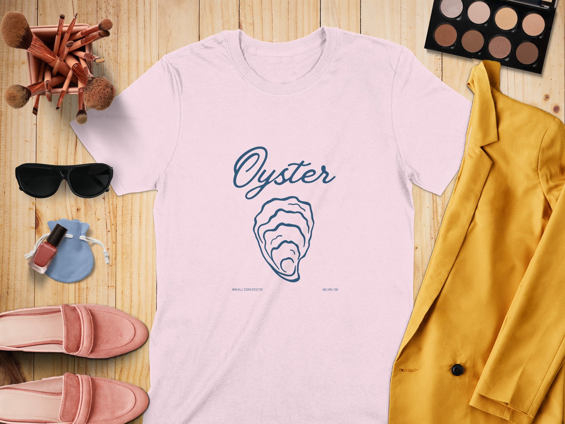 White t-shirt with blue oyster graphic and text "ALL THE SEASIDE".