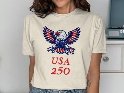 Cream t-shirt with patriotic eagle and "USA 250" text.