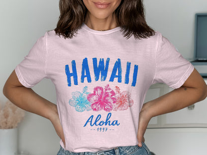 Pink t-shirt with "HAWAII Aloha - 1997" and floral graphic.