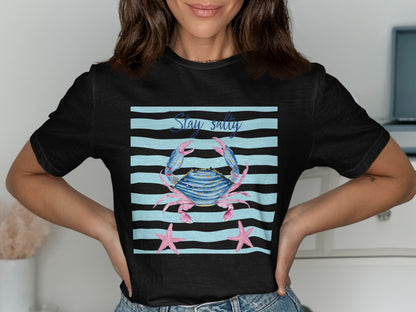 Black t-shirt with a crab and starfish graphic that reads "Stay Salty".