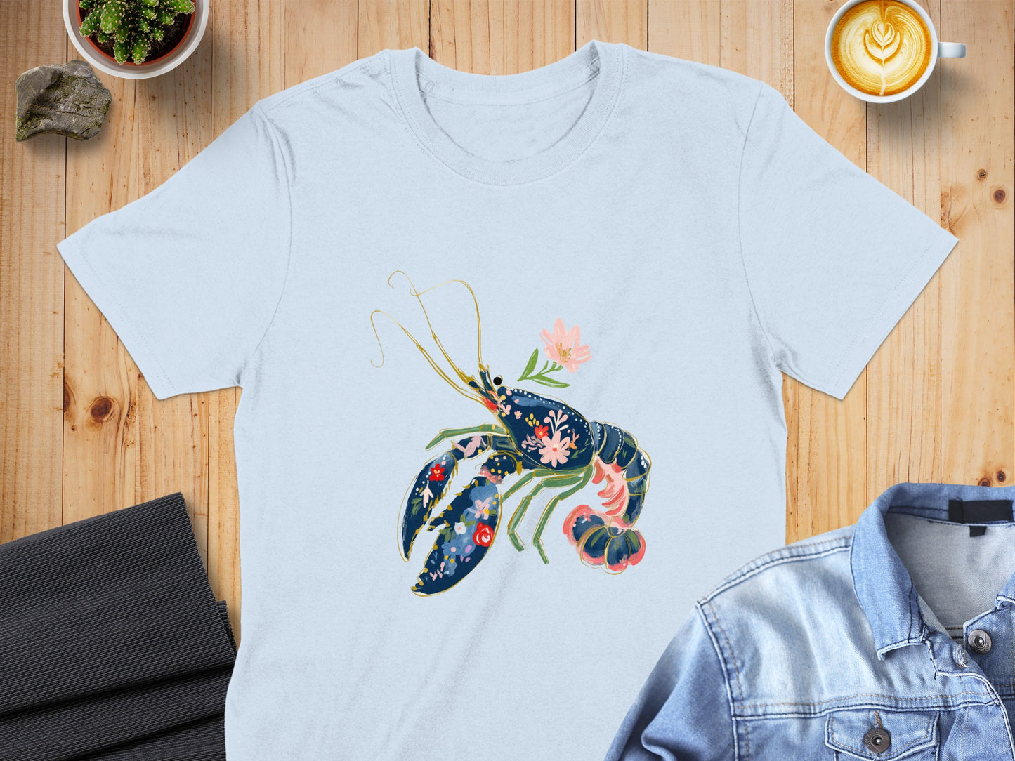 Light blue t-shirt with a floral lobster graphic.