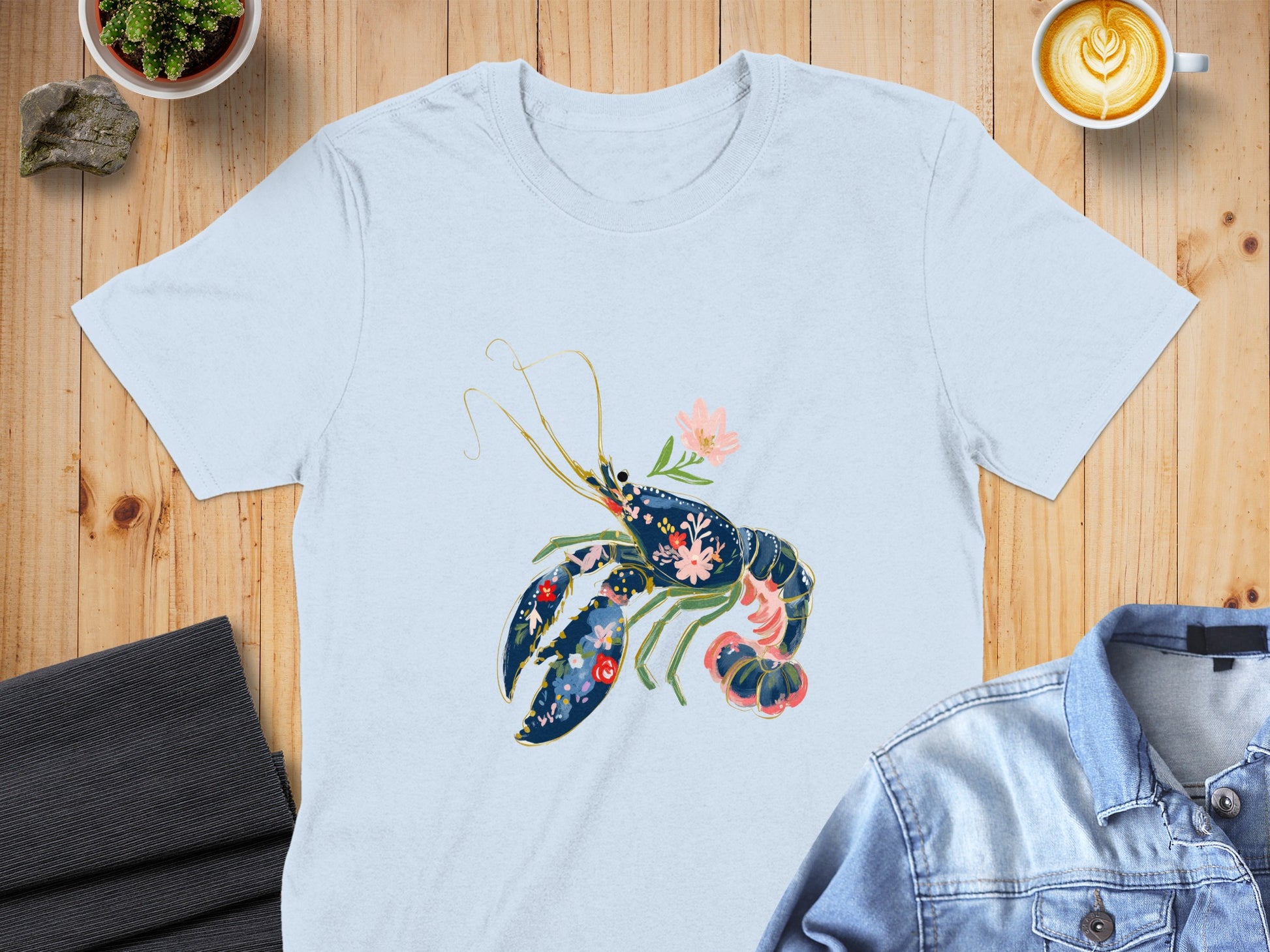 Light blue t-shirt with a floral lobster graphic.