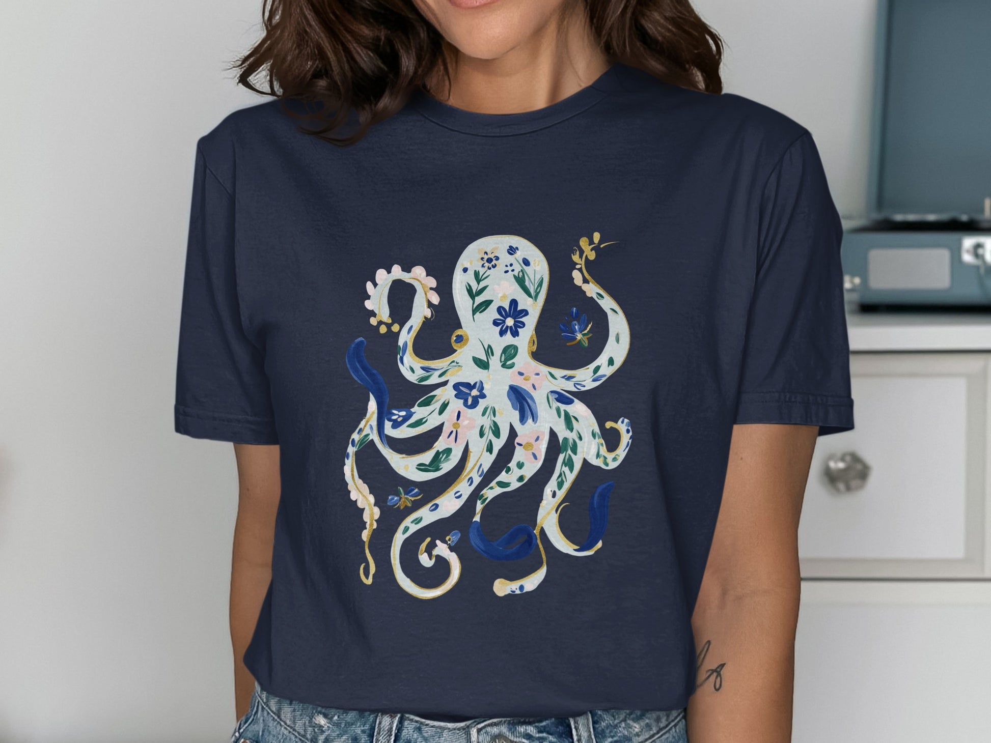 Navy t-shirt with a white and blue floral octopus design.
