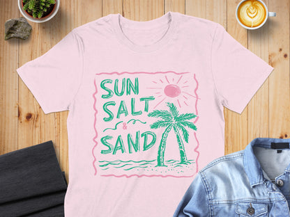 Pink t-shirt with "Sun Salt & Sand" text, palm tree, and sun graphic.