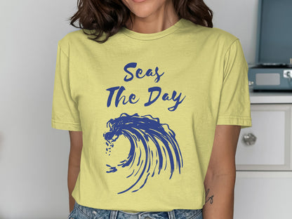 Yellow t-shirt with blue wave graphic and "Seas The Day" text.