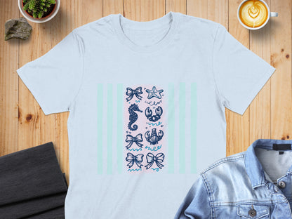 Light blue t-shirt with bow, seahorse, crab, and starfish illustration.