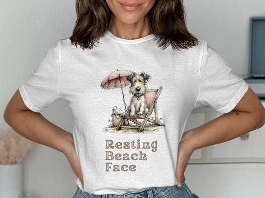 Dog sitting on a beach chair under an umbrella with "Resting Beach Face" text.