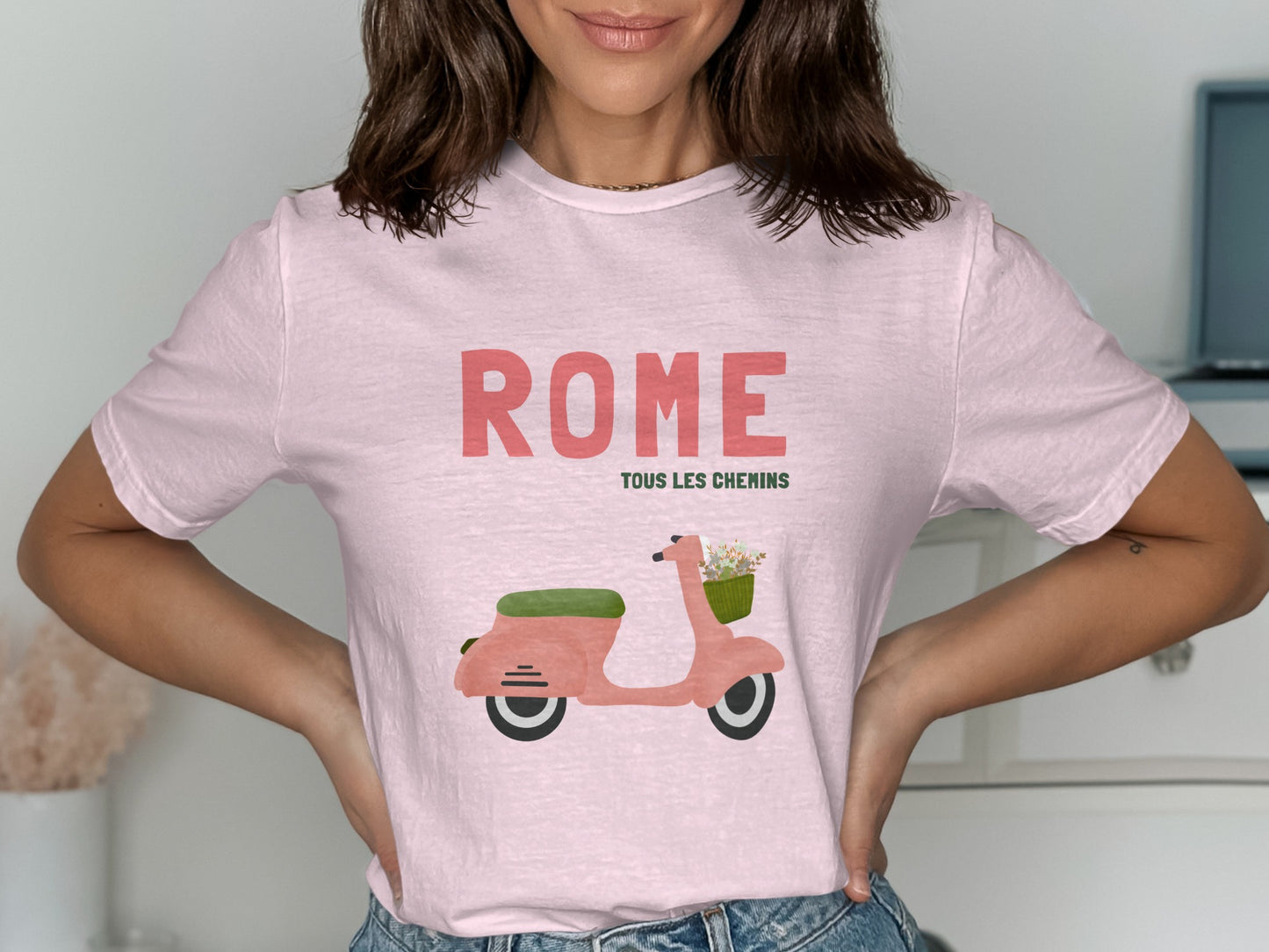 Pink t-shirt with "Rome Tous Les Chemins" and a pink scooter with flowers.