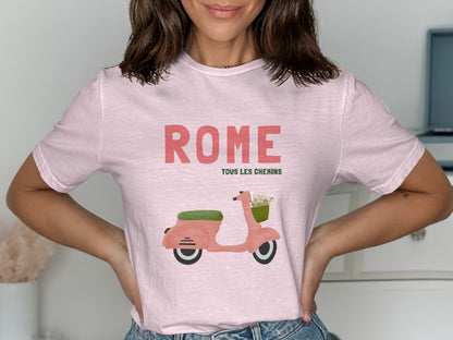 Pink t-shirt with "Rome Tous Les Chemins" and a pink scooter with flowers.