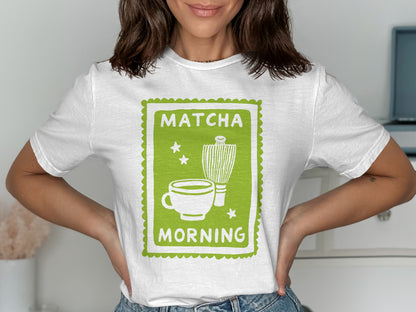 White t-shirt with green graphic of a matcha cup, whisk, and "Matcha Morning" text.