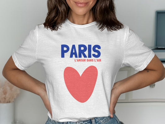 White t-shirt with "PARIS L'AMOUR DANS L'AIR" and a red heart.