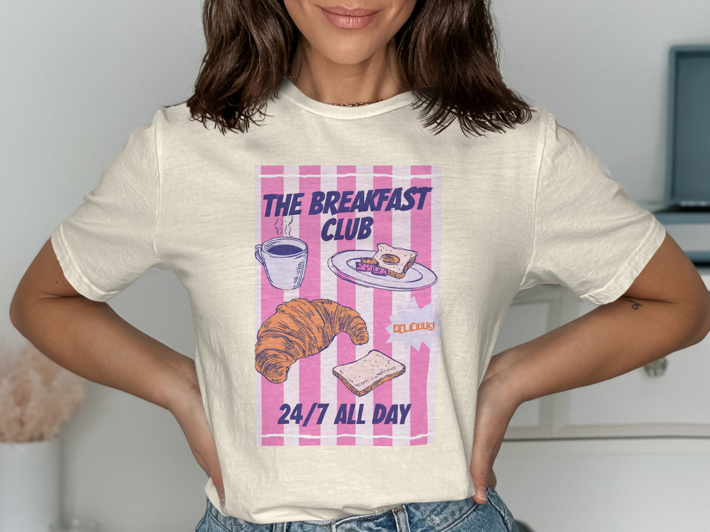 T-shirt with "The Breakfast Club 24/7 All Day" text, croissant, and sandwich.