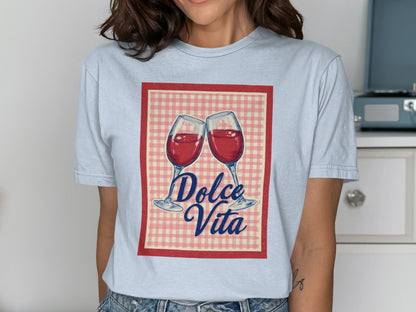 Two wine glasses clinking with "Dolce Vita" text on a checkered background.