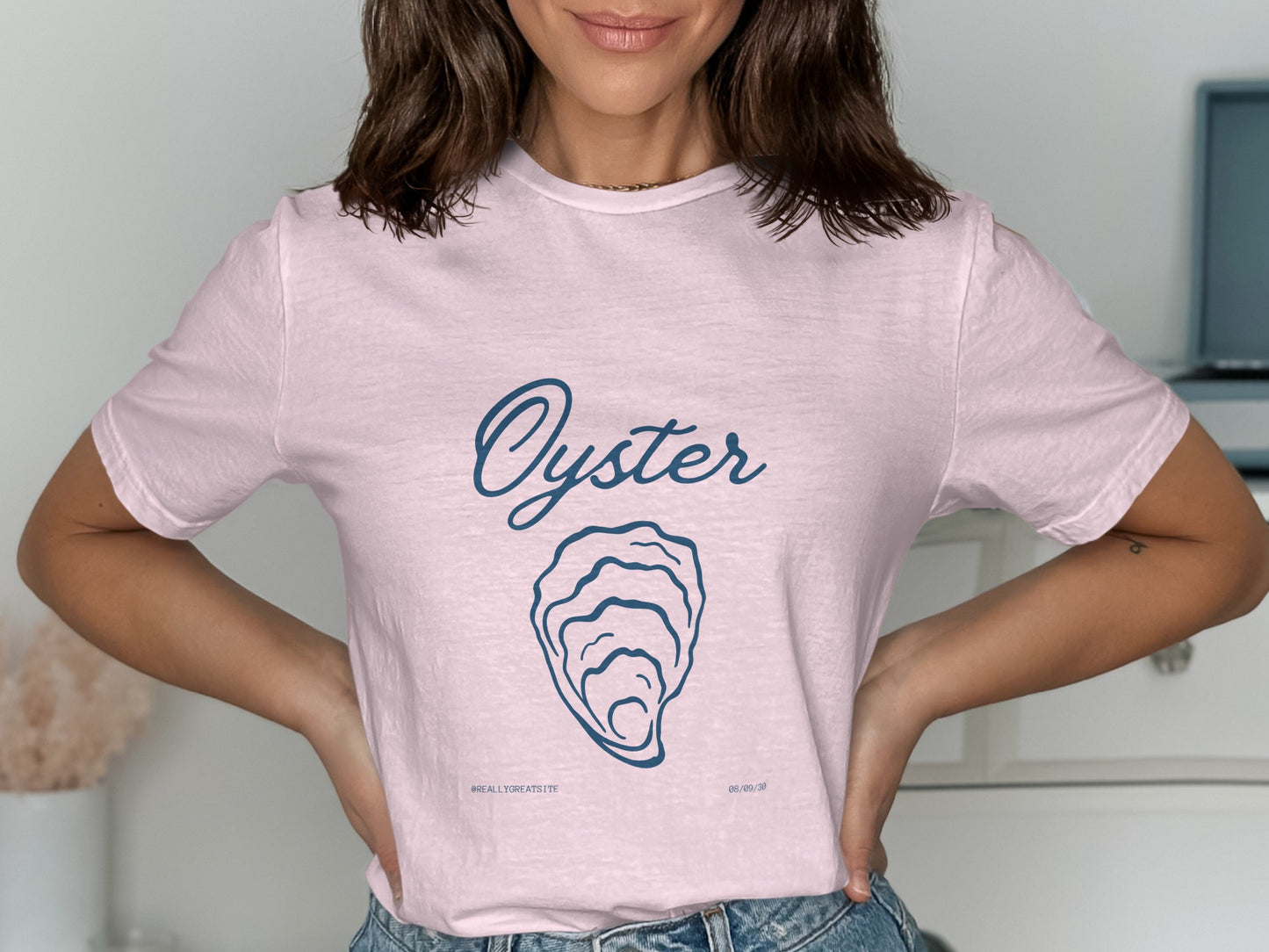 Pink t-shirt with "Oyster" text and an oyster illustration.