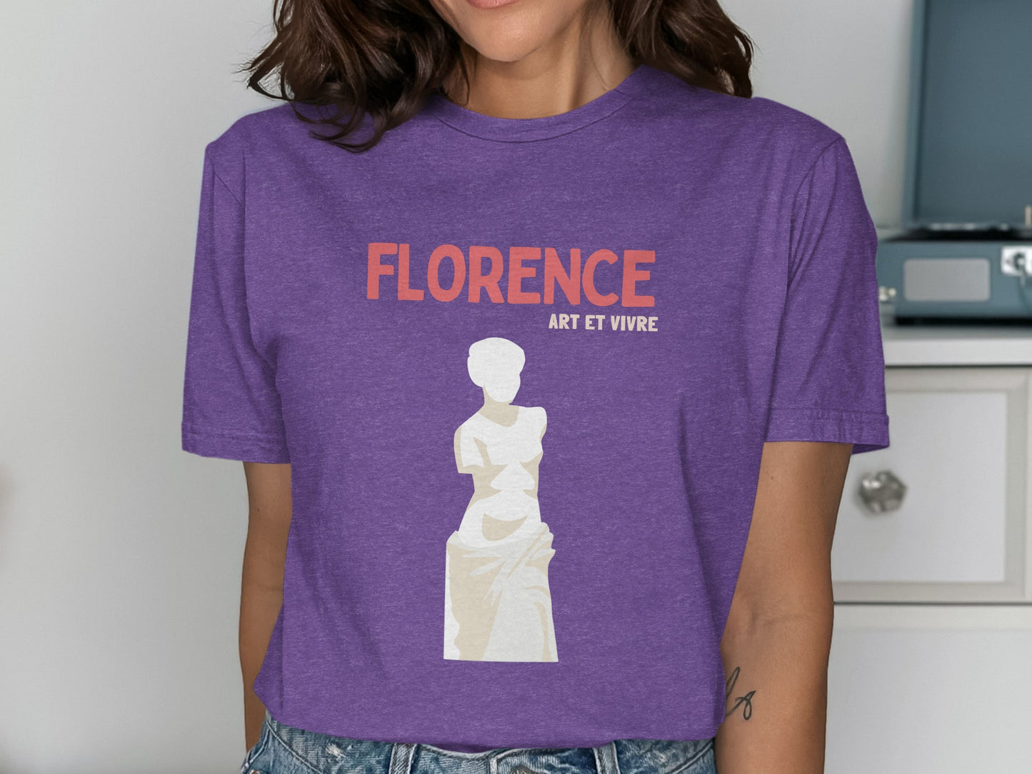 Purple t-shirt with "FLORENCE ART ET VIVRE" text and statue graphic.