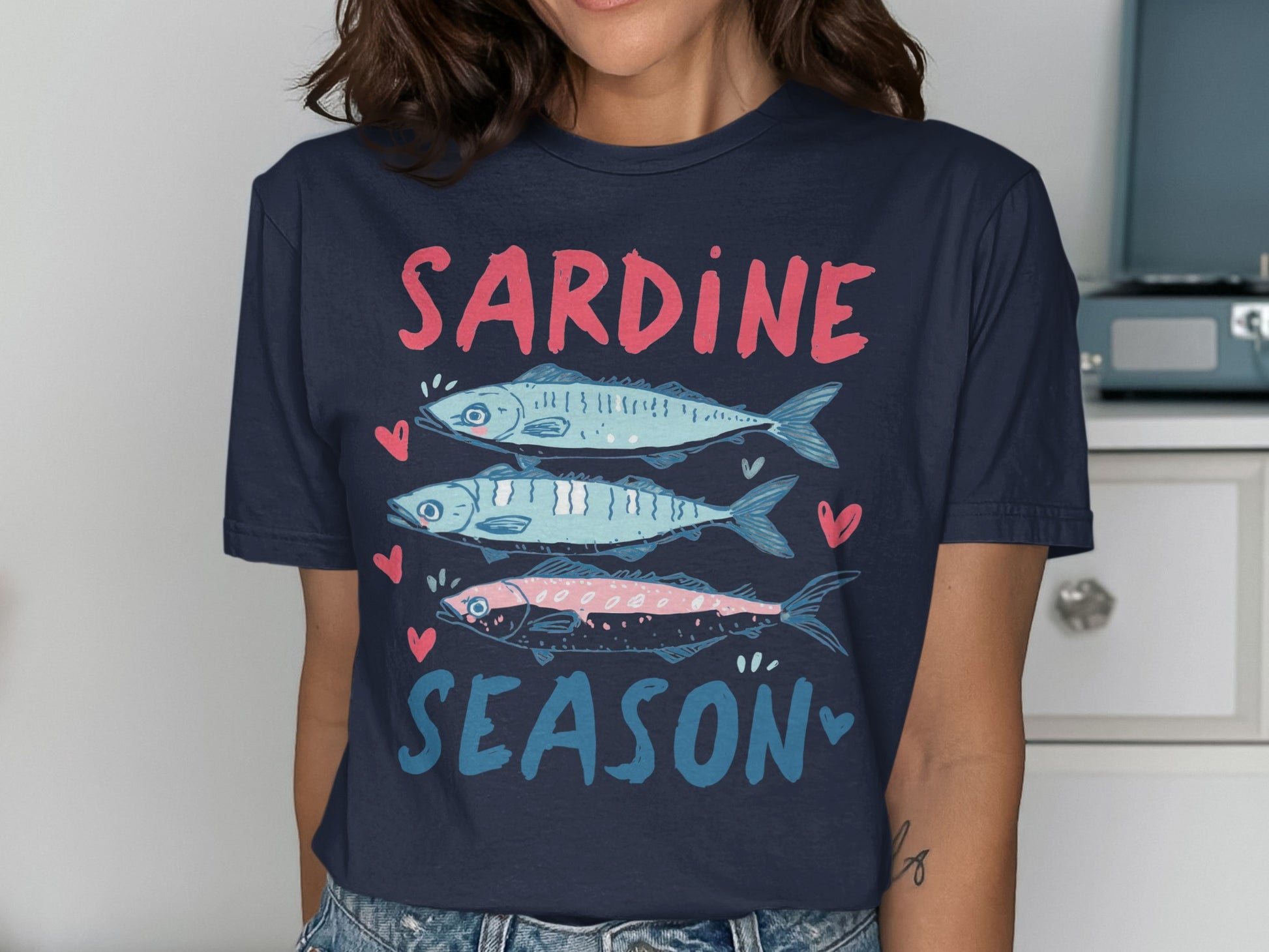 Navy t-shirt with "SARDINE SEASON" and three stylized sardines.