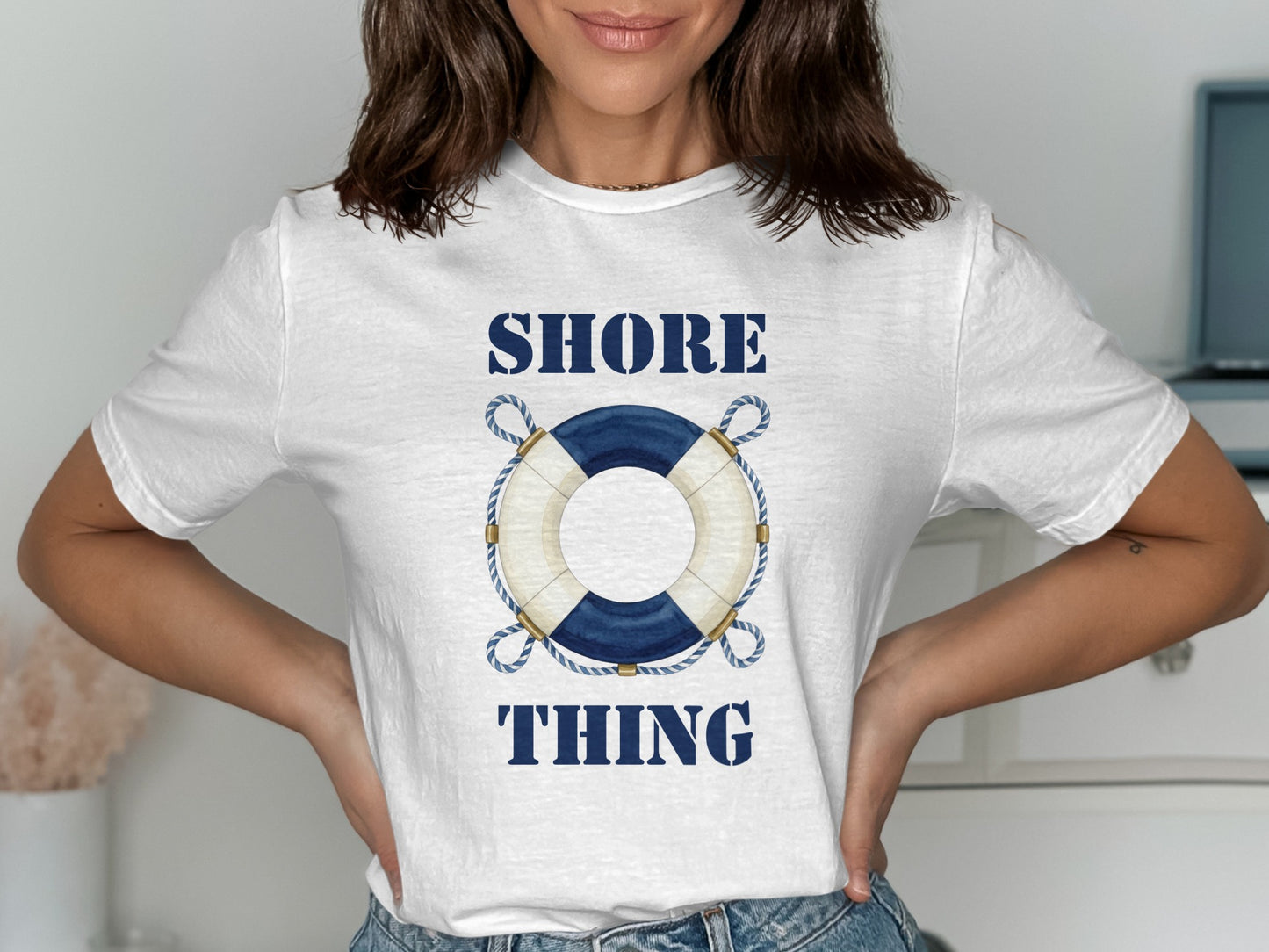 White t-shirt with blue "SHORE THING" text and a life preserver graphic.