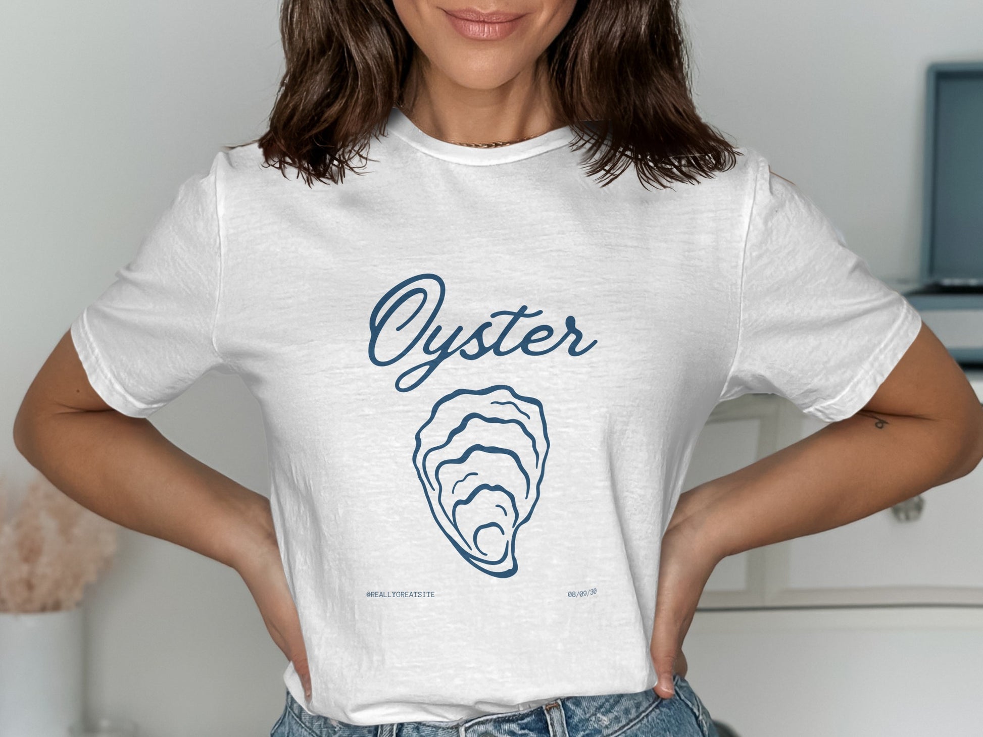 White t-shirt with blue "Oyster" text and shell illustration.