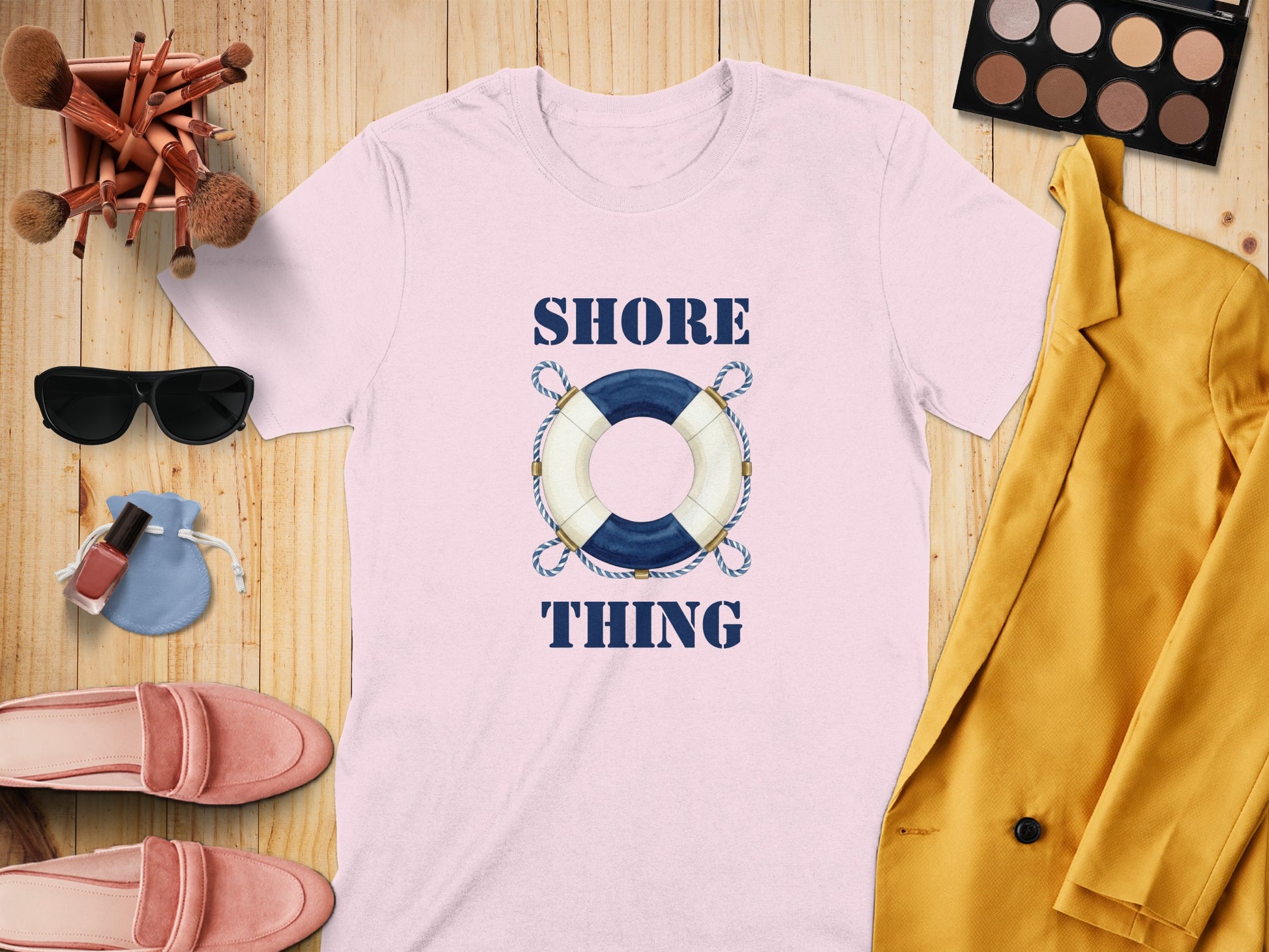 Pink t-shirt with "Shore Thing" text and life preserver graphic.