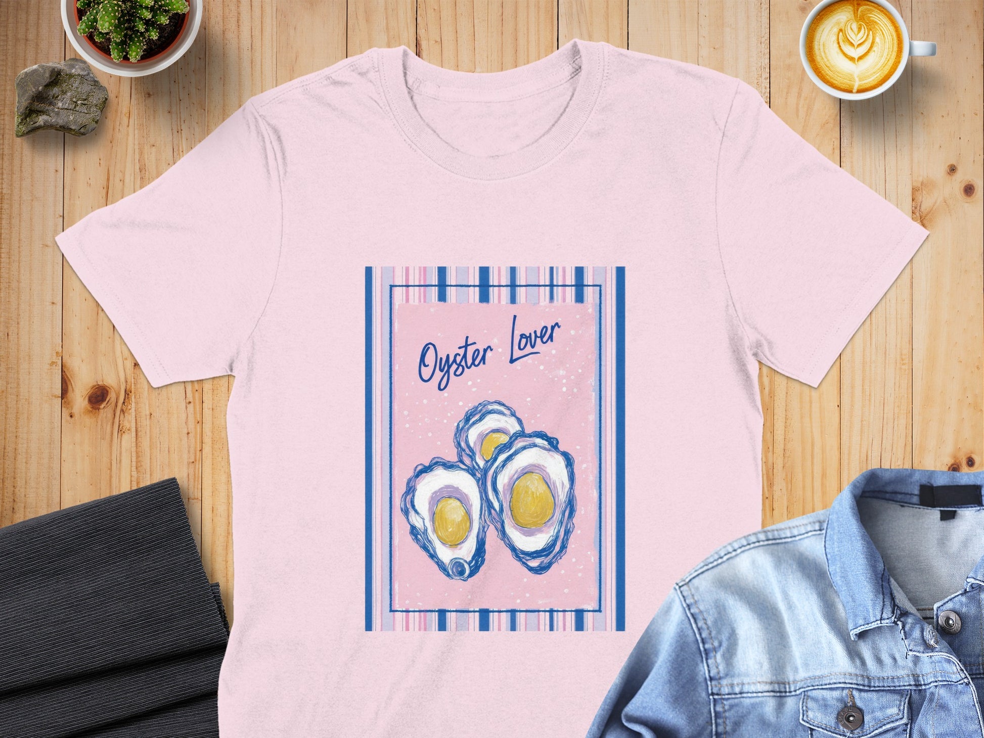 Pink t-shirt with "Oyster Lover" text and three stylized oysters.