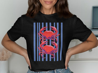 Black t-shirt with two red crabs against a blue striped background.
