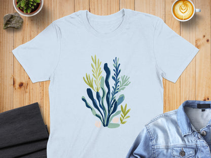 Light blue t-shirt with abstract green and blue seaweed illustration.