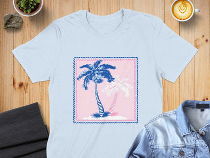 Light blue t-shirt with pink and blue palm trees graphic in a pink and blue border.