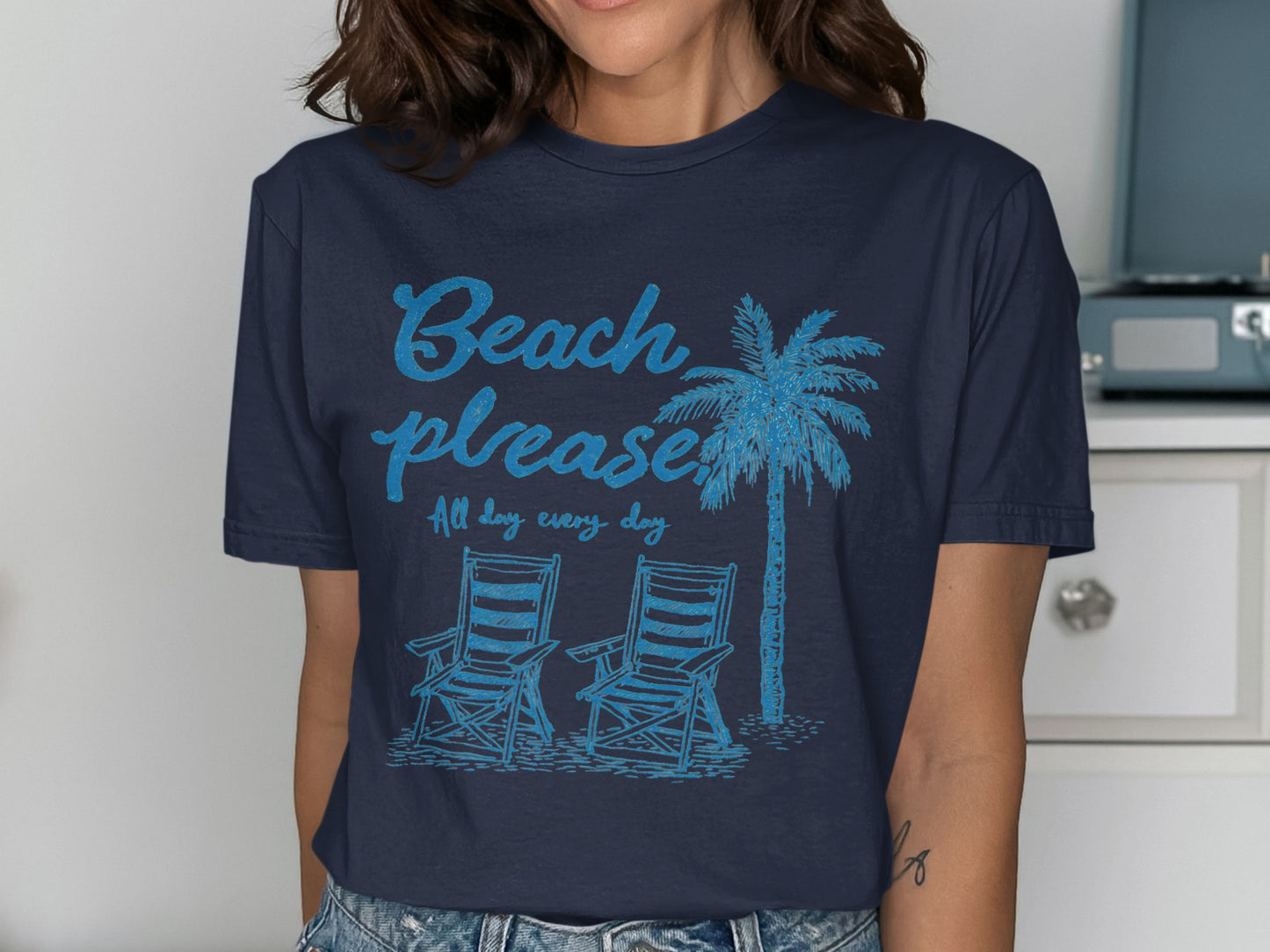 Navy t-shirt with "Beach please all day every day" text and palm tree.
