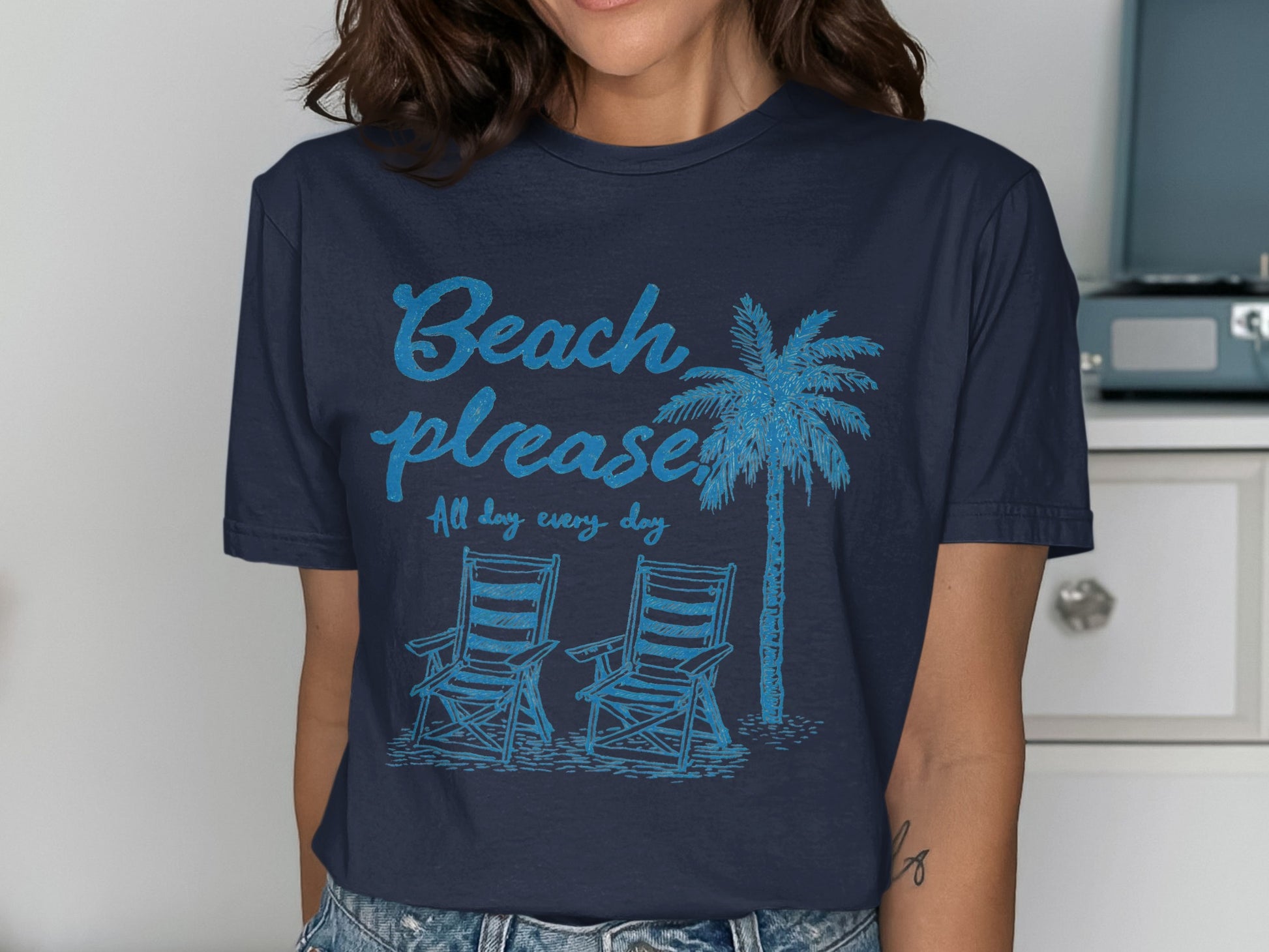 Navy t-shirt with "Beach please all day every day" text and palm tree.